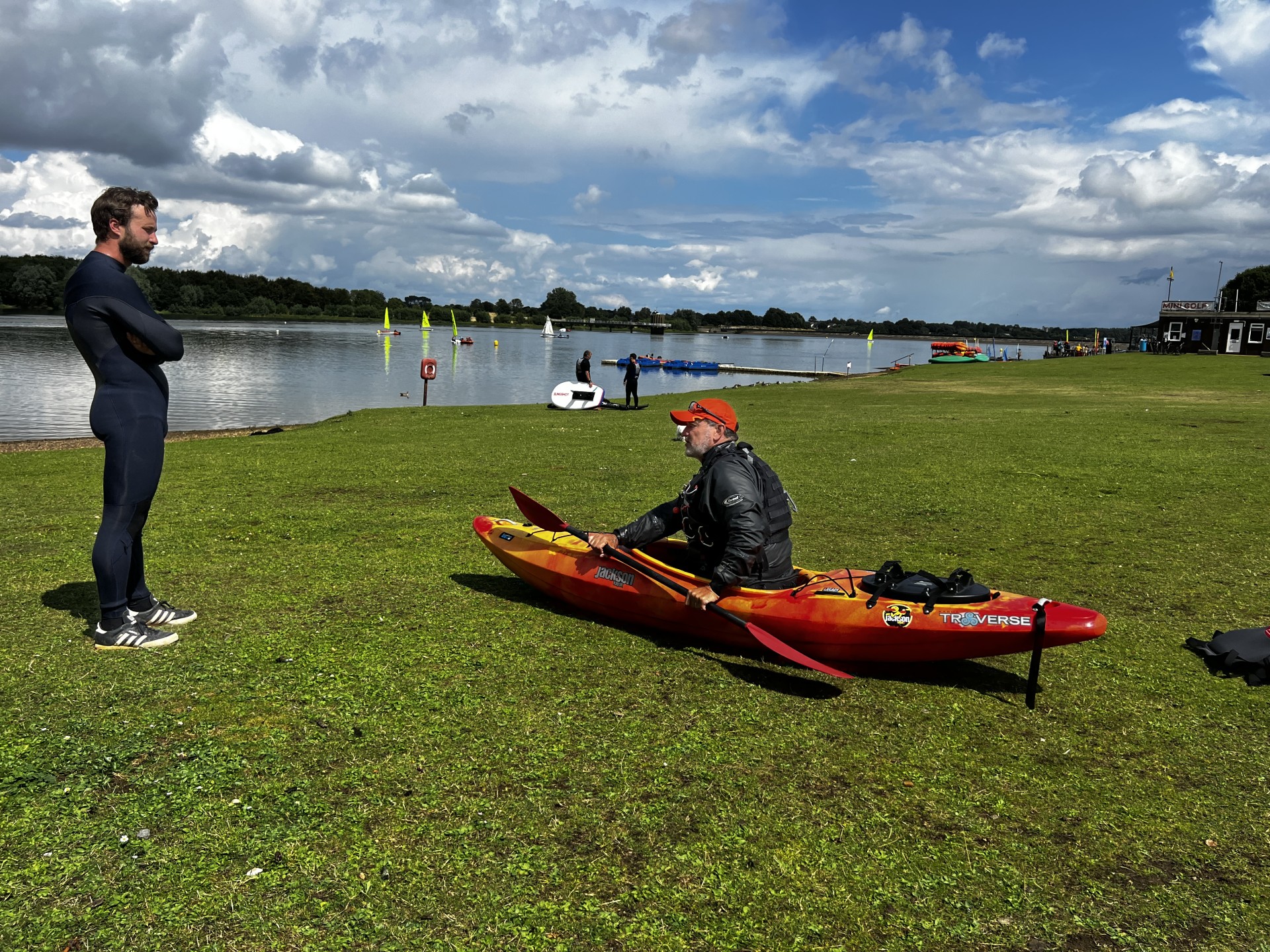 Bank work with an student learning to eskimo roll his kayak.