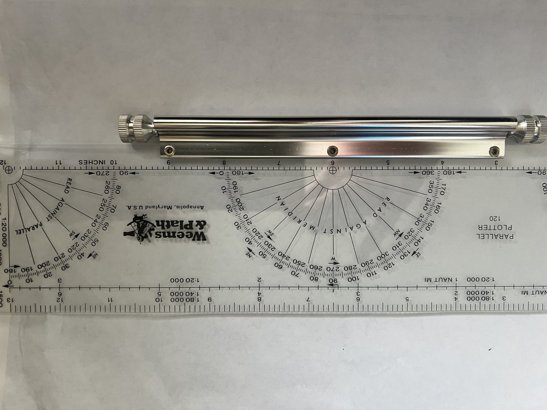 Parallel rule with protractors and roller for smooth operation over your chart.