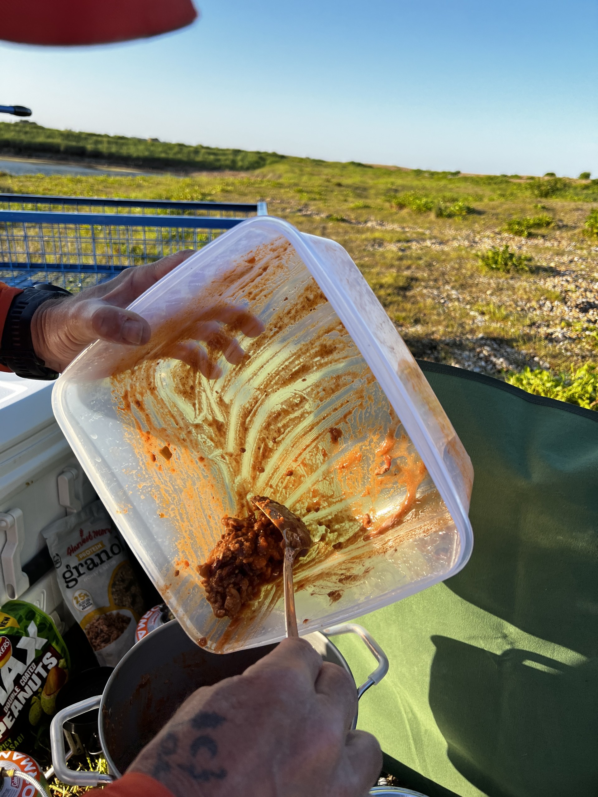 Fresh mince goes in to the pot for heating on 'All Inclusive' wild camping event.