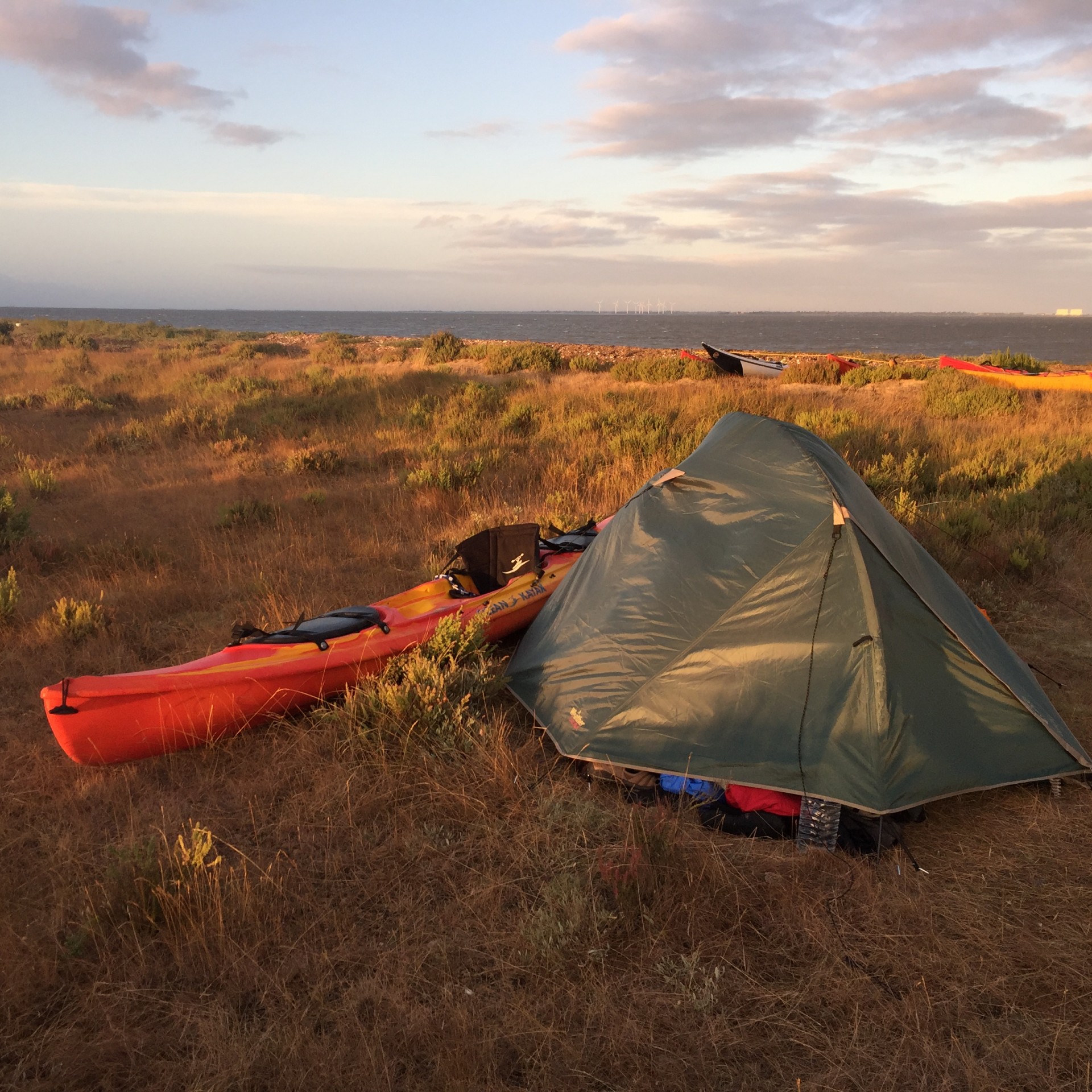 Tent on the beach with a kayak.