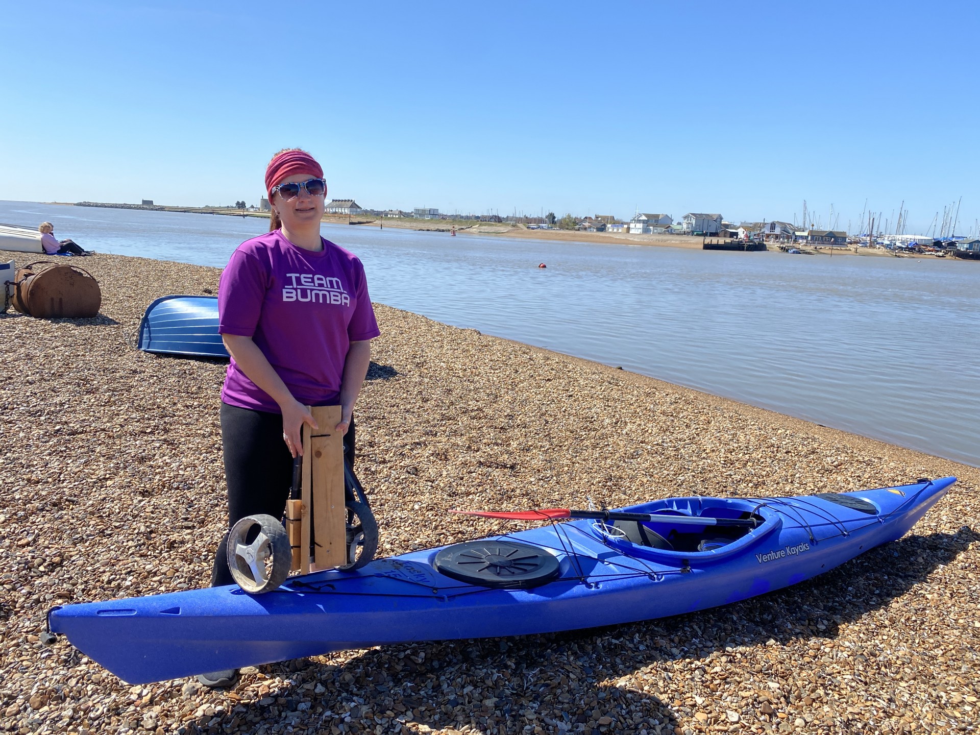 This girl can on the beach preparing for launch.