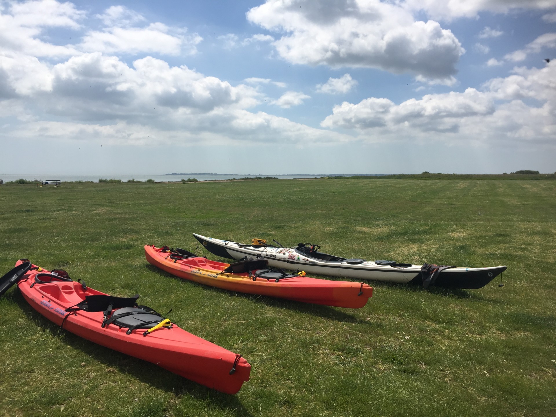 Kayaks on the grass ready to launch.