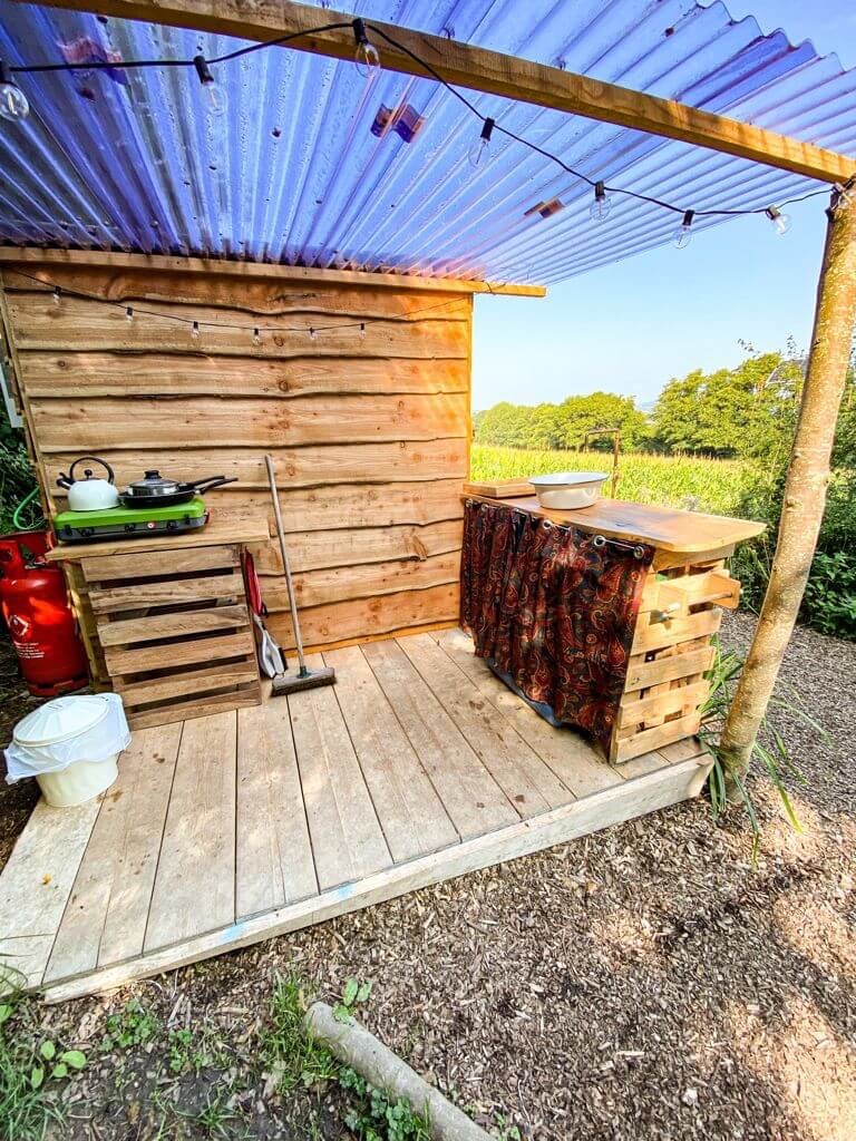 Outdoor kitchen on Hollyhocks Eco Retreat glamping site.