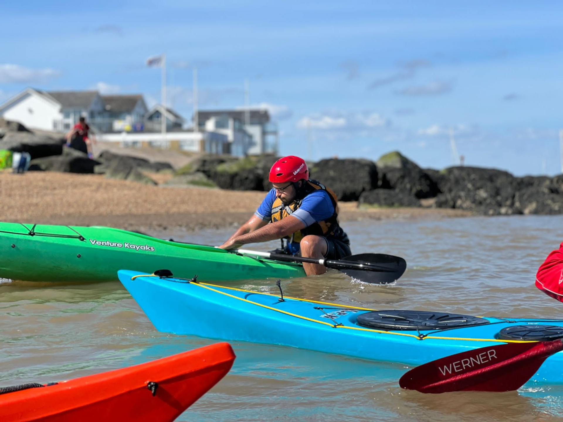 Back deck scramble rescue in a touring kayak with NOMAD Sea Kayaking.