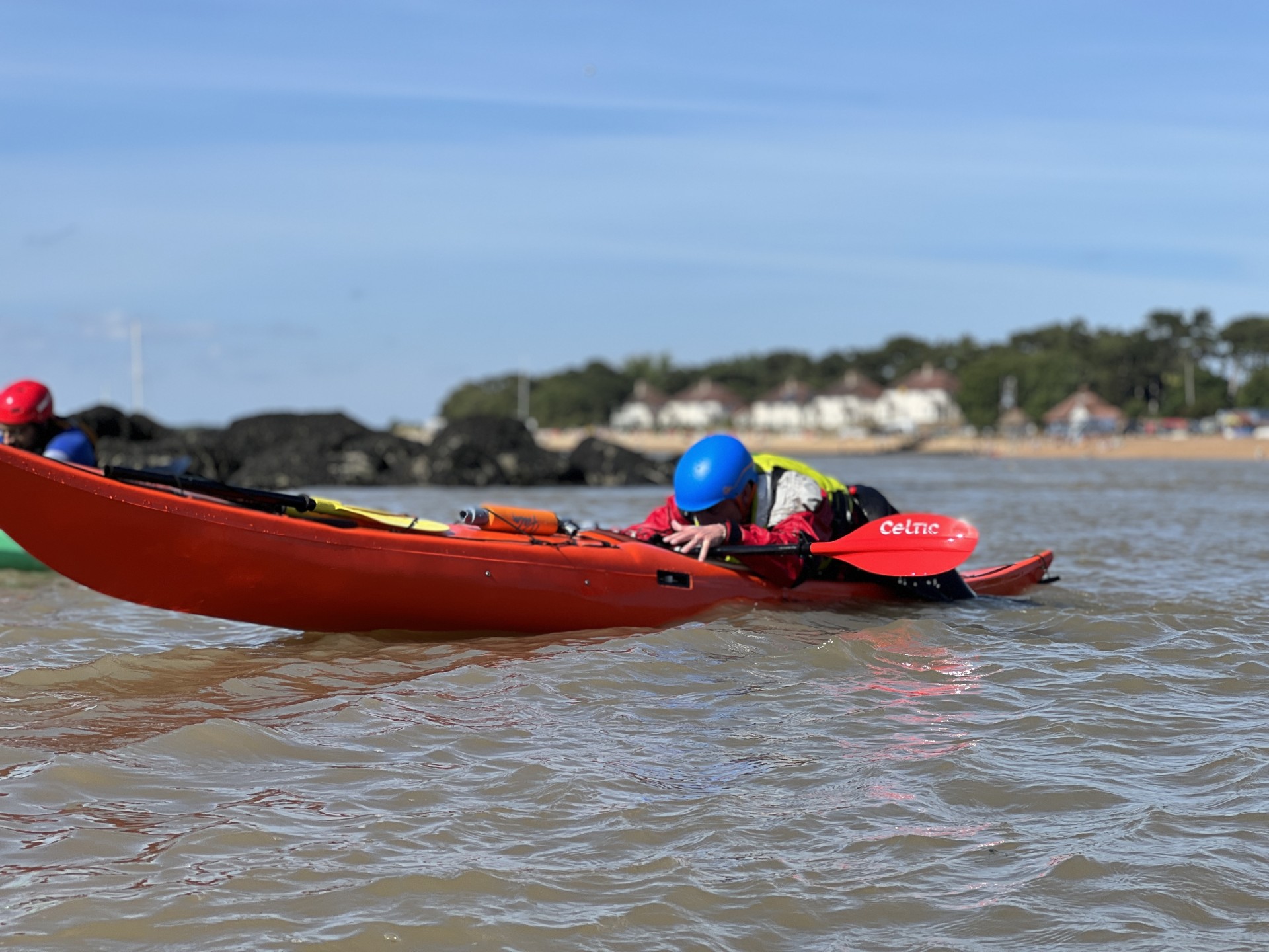 Learning to back deck scramble on NOMAD Sea Kayaking's Recoveries for Kayakers course.