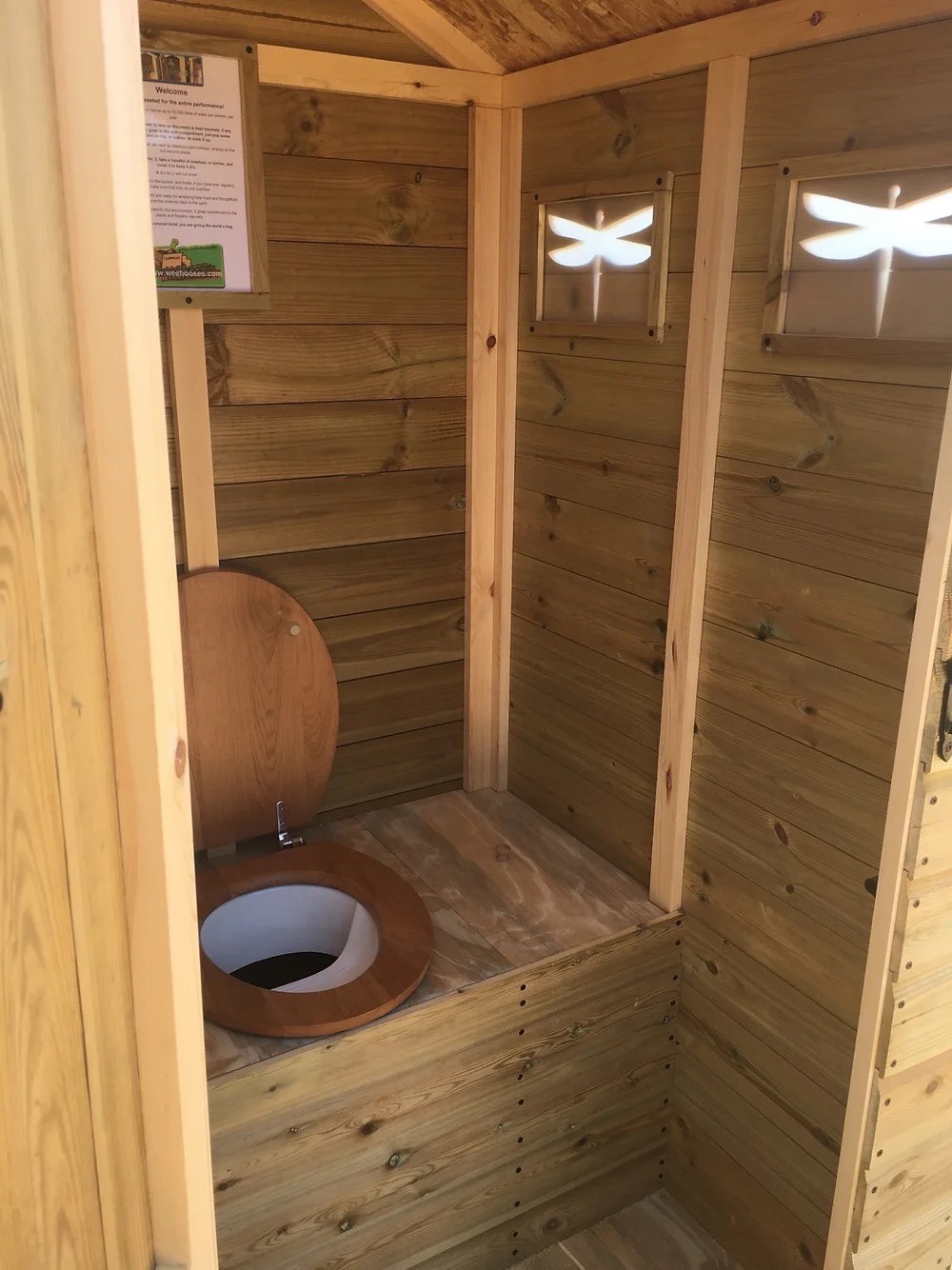 Interior view of composting toilet on Hollyhocks Eco Retreat glamping site.