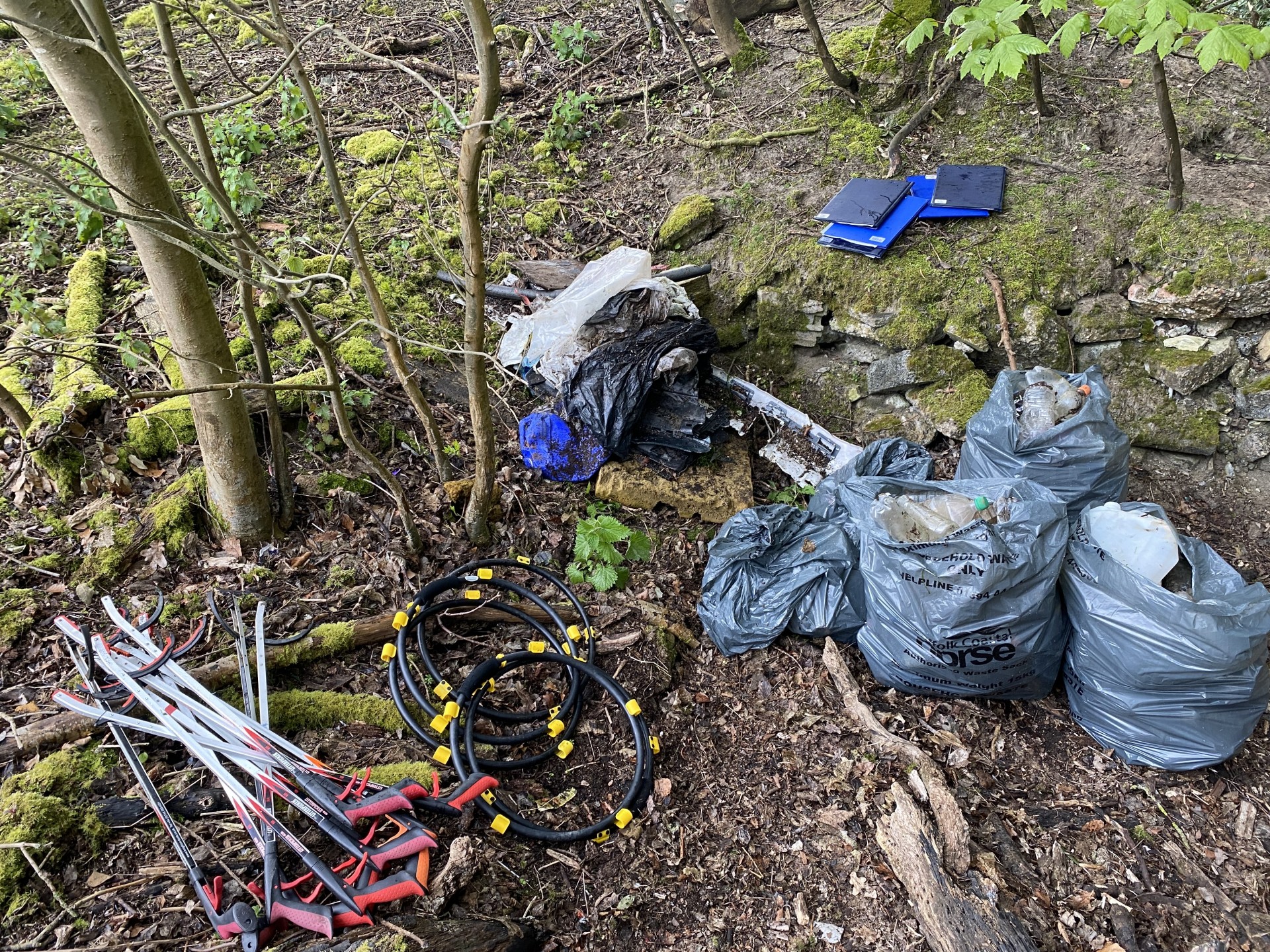 Refuse collection rings & litter pickers next to bags of refuse collected by volunteers to NOMAD Community Projects.