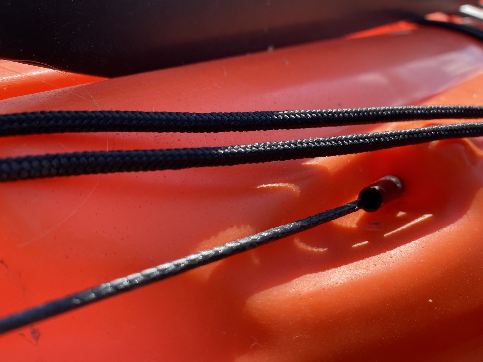 Sit-on-top kayak rudder entry point of steering cable