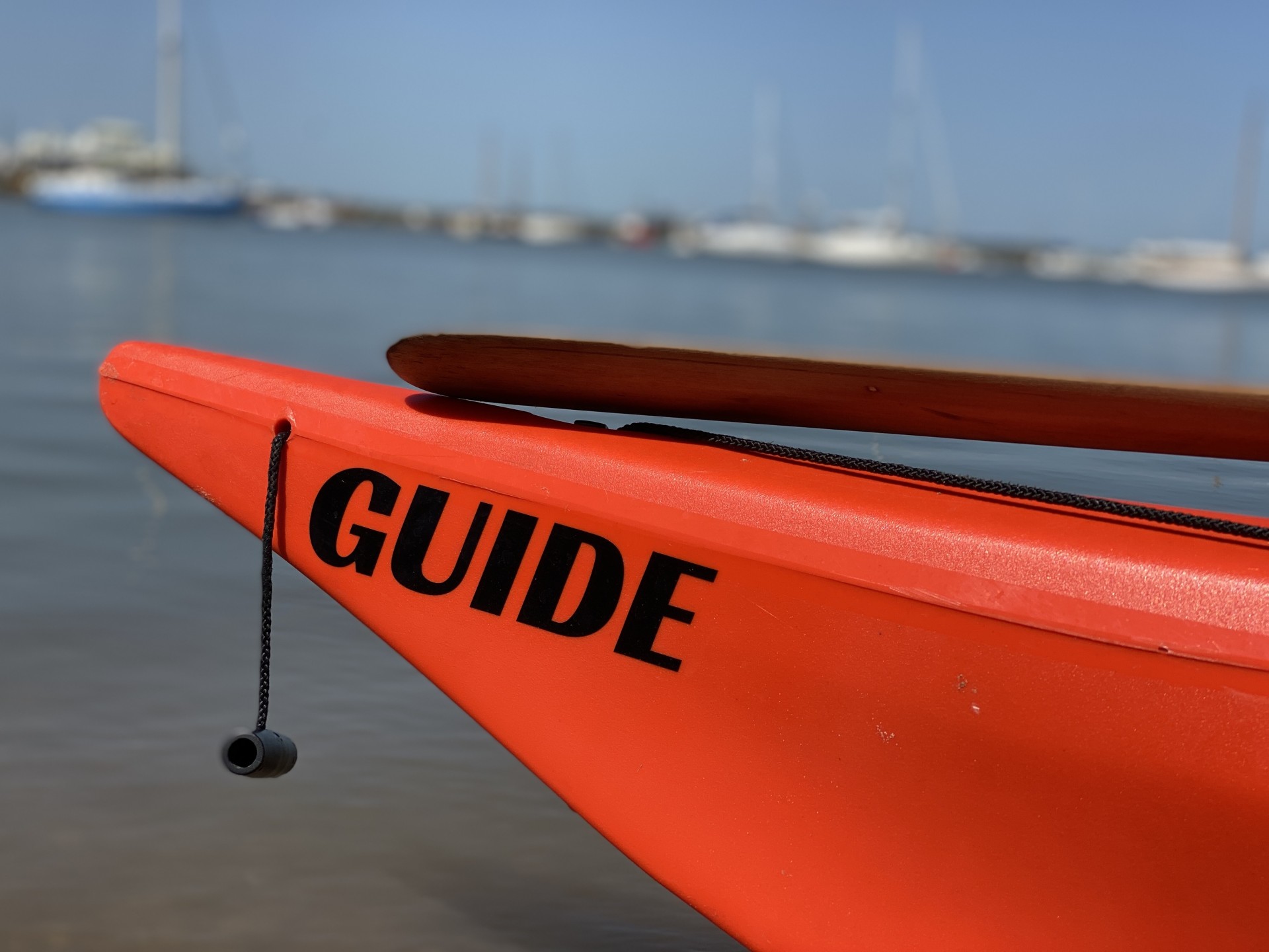Orange NOMAD sea kayaking Guide boat.