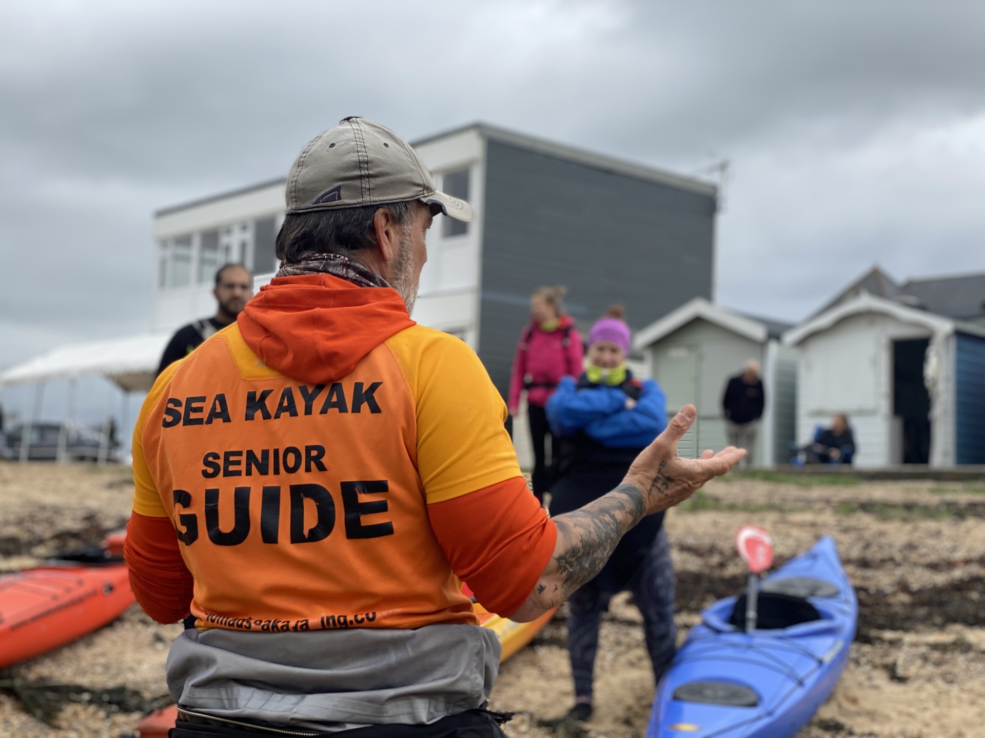 Lead Guide with NOMAD Sea Kayaking briefing his guests before launch with NOMAD Sea Kayaking.